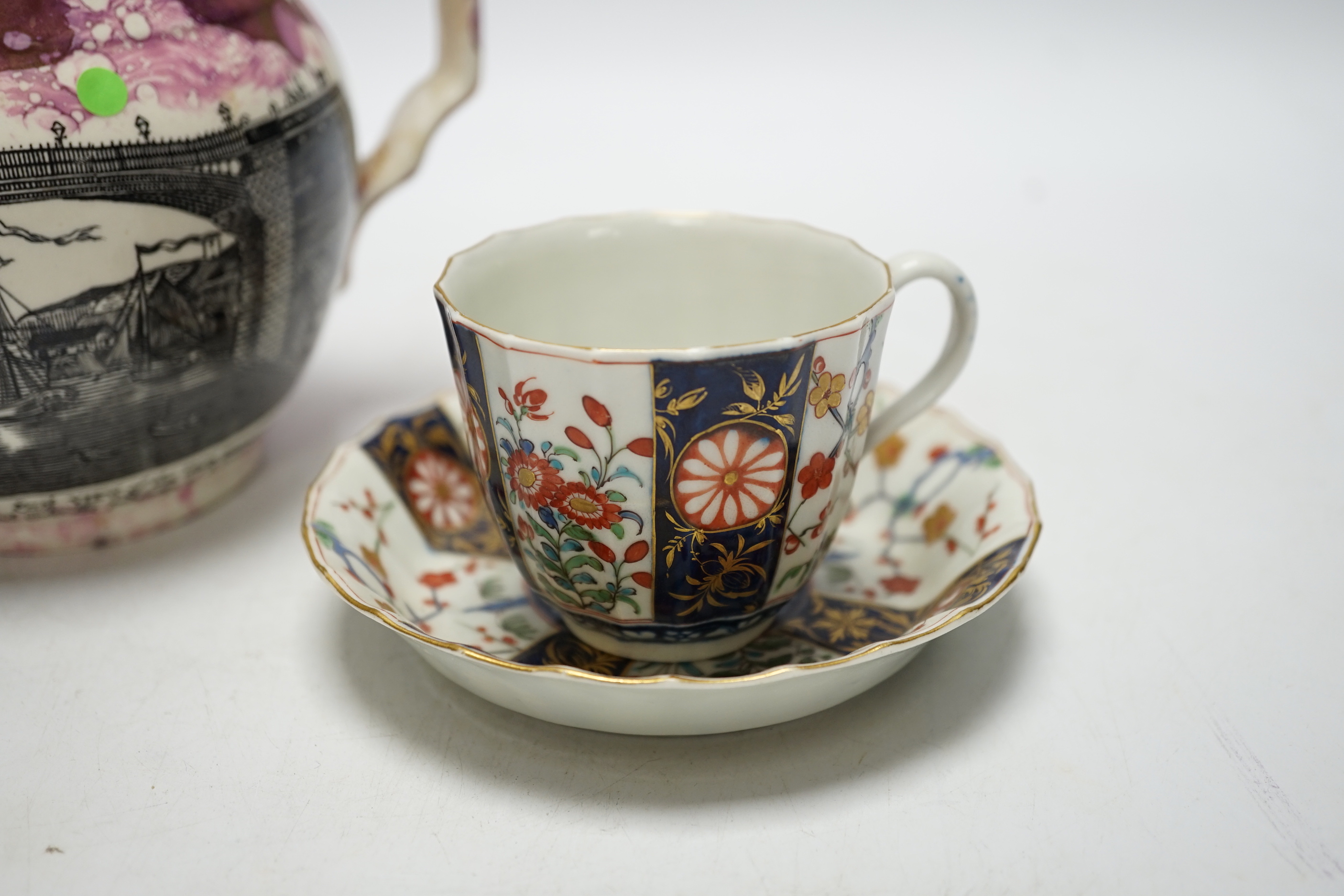 A Worcester Kakiemon pattern coffee cup and saucer, c.1780 and Gray’s Pottery pink lustre ‘’Iron Bridge Sunderland’’ jug, (3), 13cm